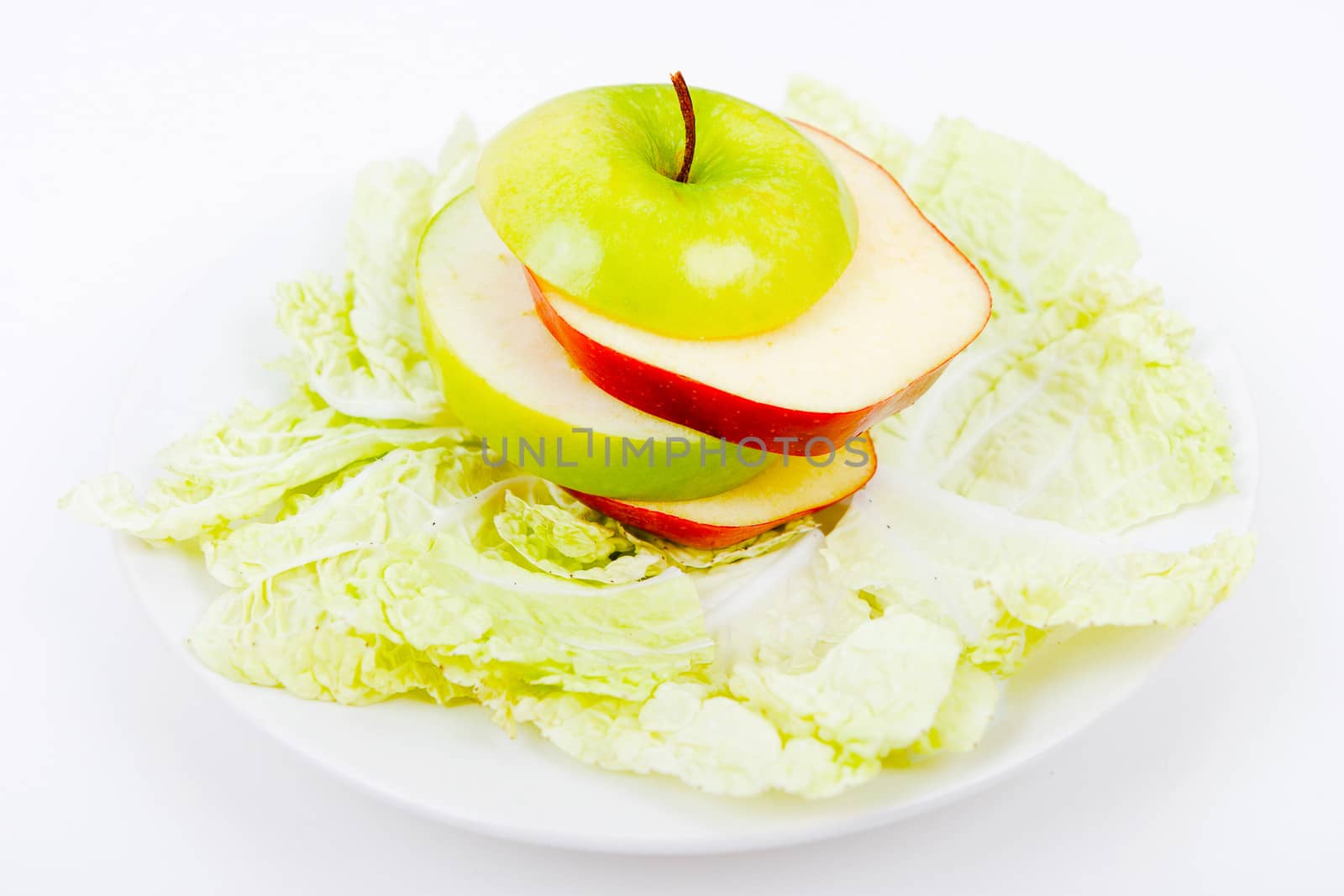 plate with salad and apples. vegetarian food
