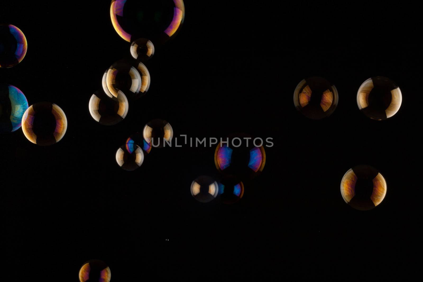 a bunch of color Soap bubbles on black background