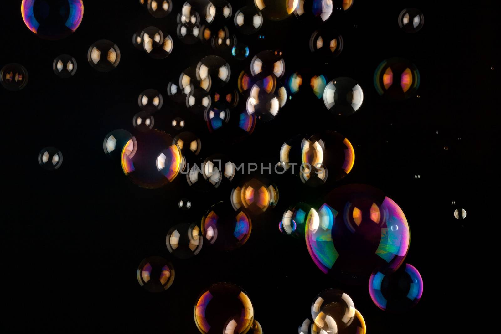 a bunch of color Soap bubbles on black background