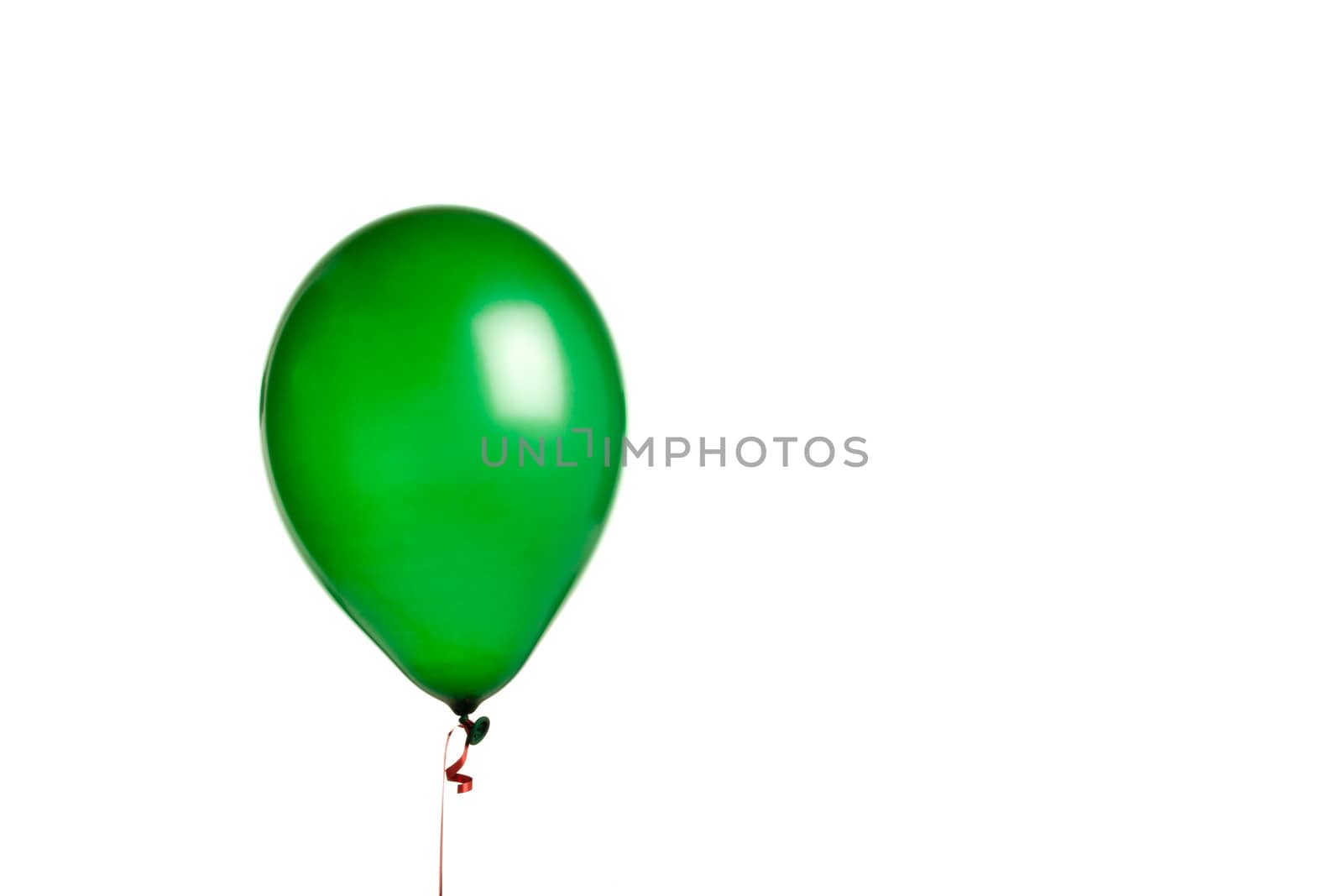 green balloon isolated on white with red string