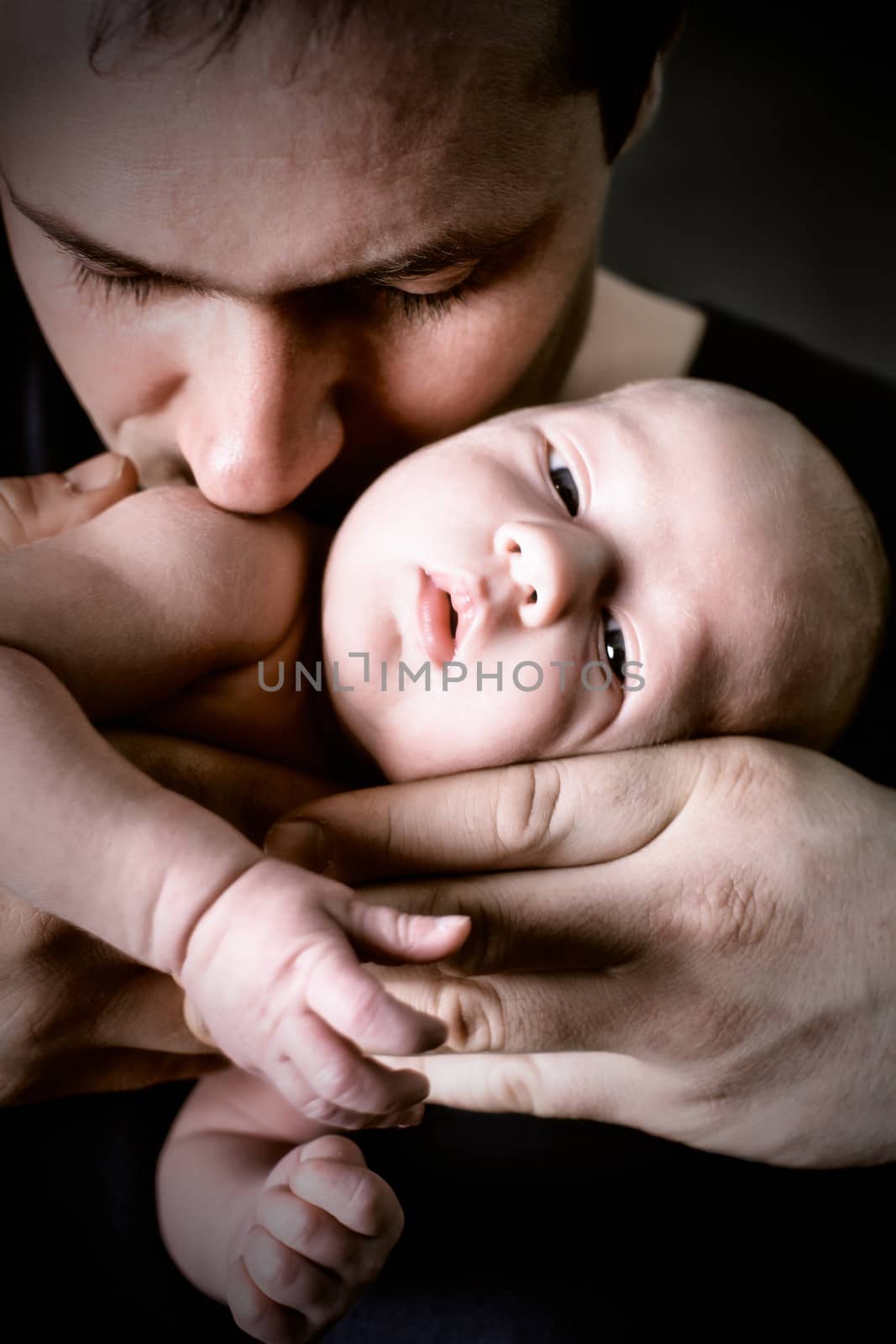baby on father's hands by oksix