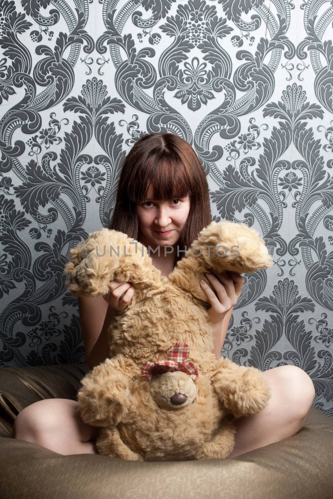 A girl and a big soft toy
