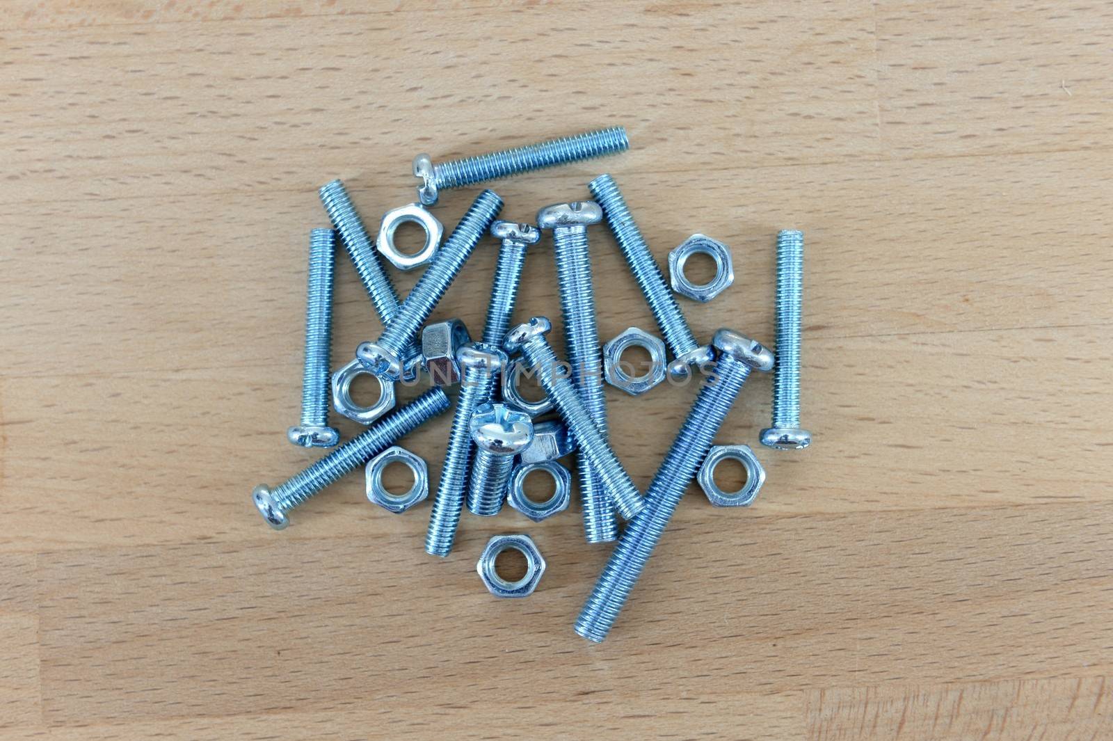 Hardware fixings isolated on a wooden bench