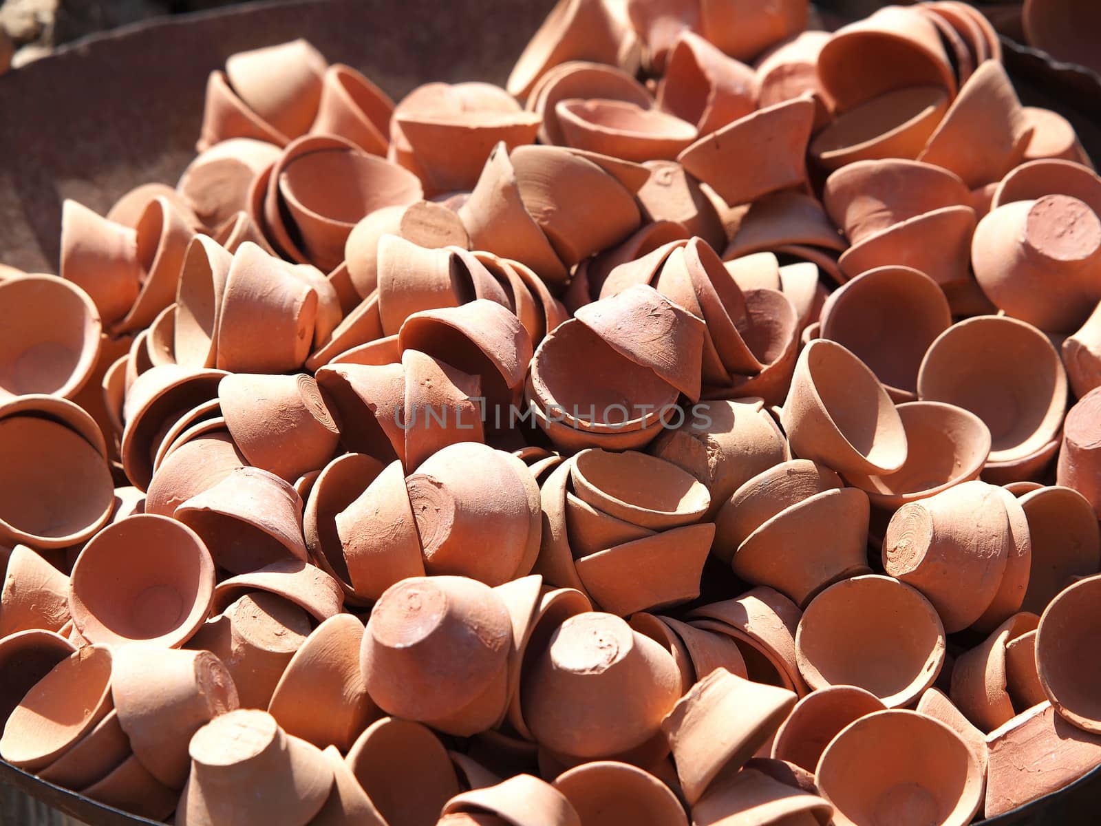 small clay pots on the sun of India       