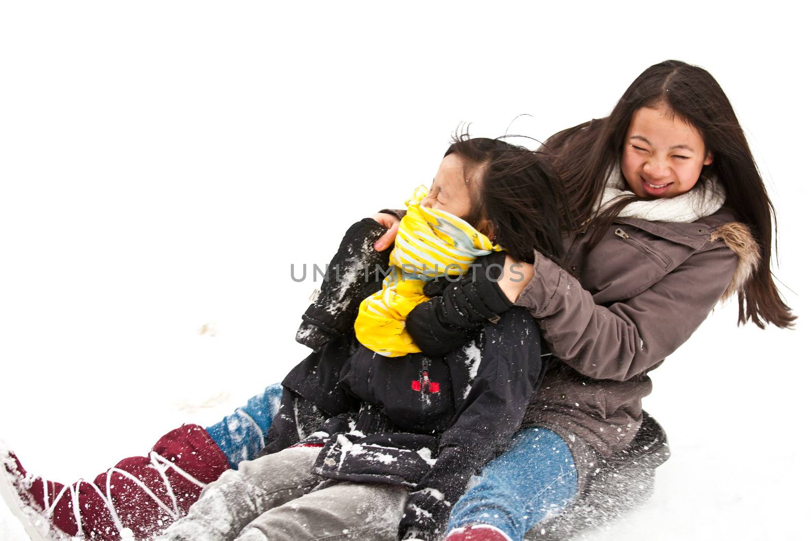 Girl sledging in winter in Denmark