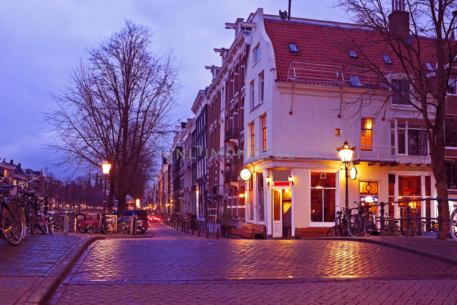 Streetview with amsterdam cafe in the Netherlands by twilight