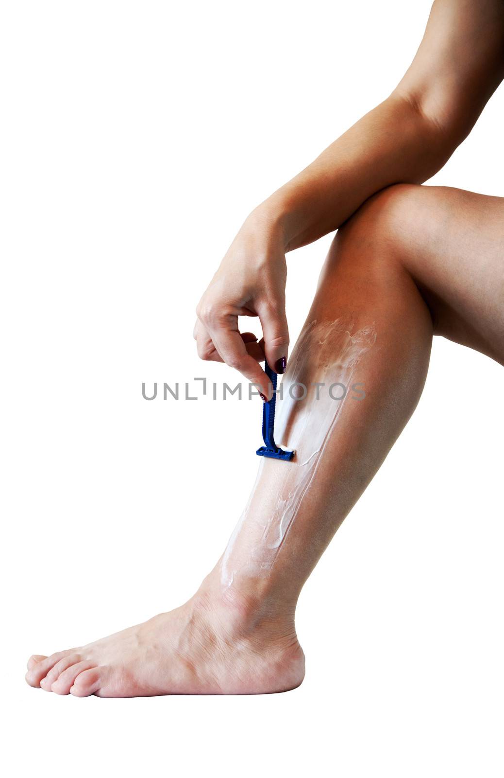 woman shaves leg isolated on white background