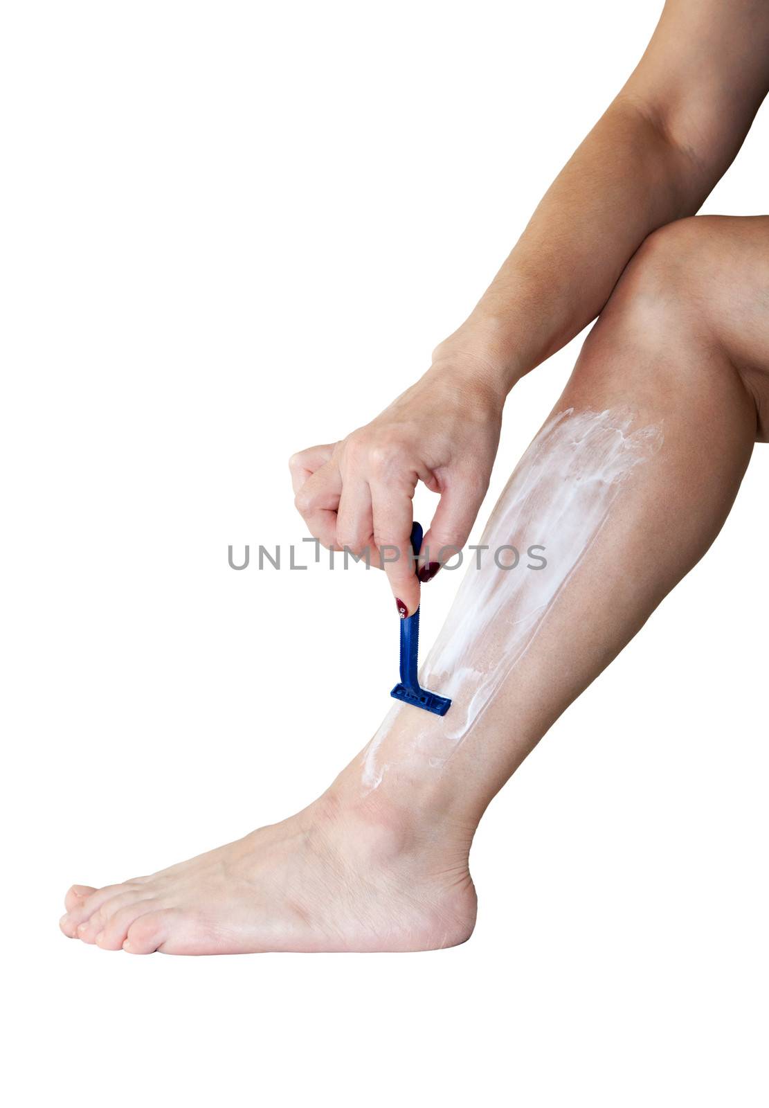 woman shaves her leg isolated on white background