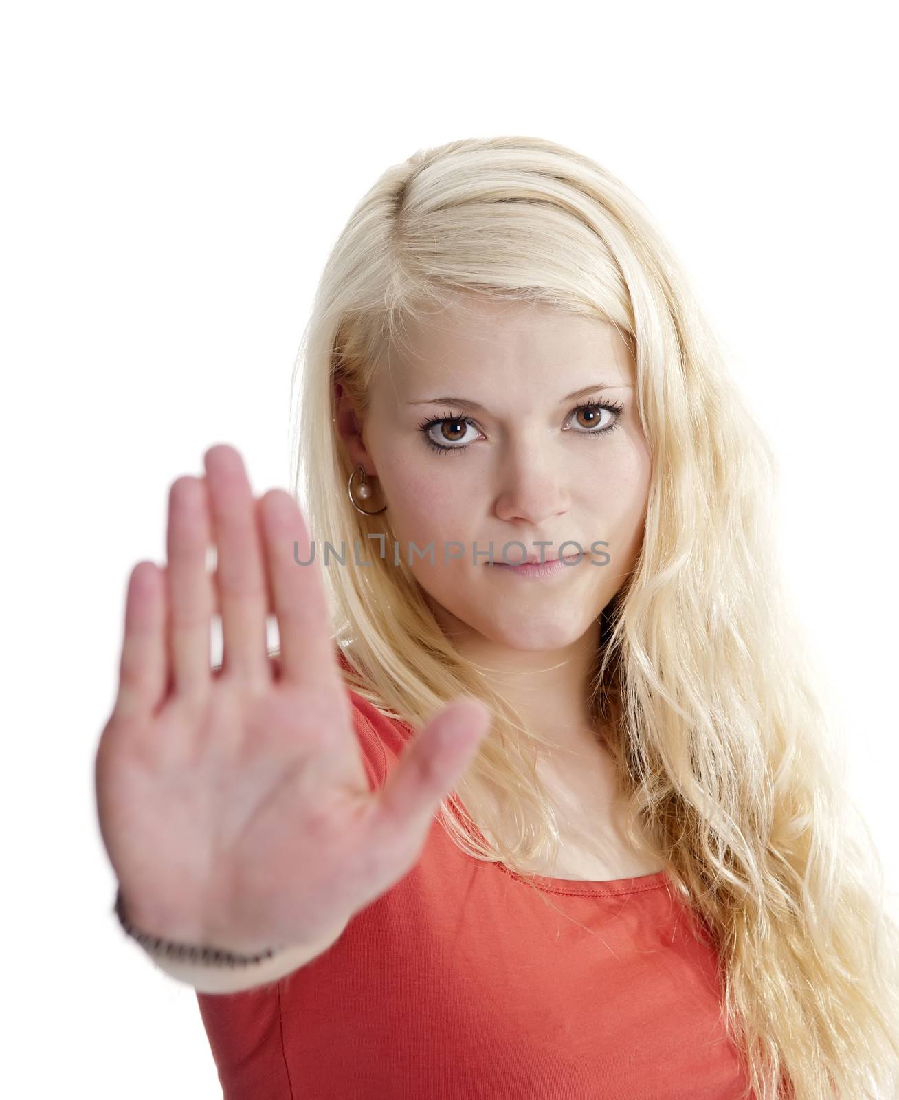 beautiful young woman showing stop with one hand