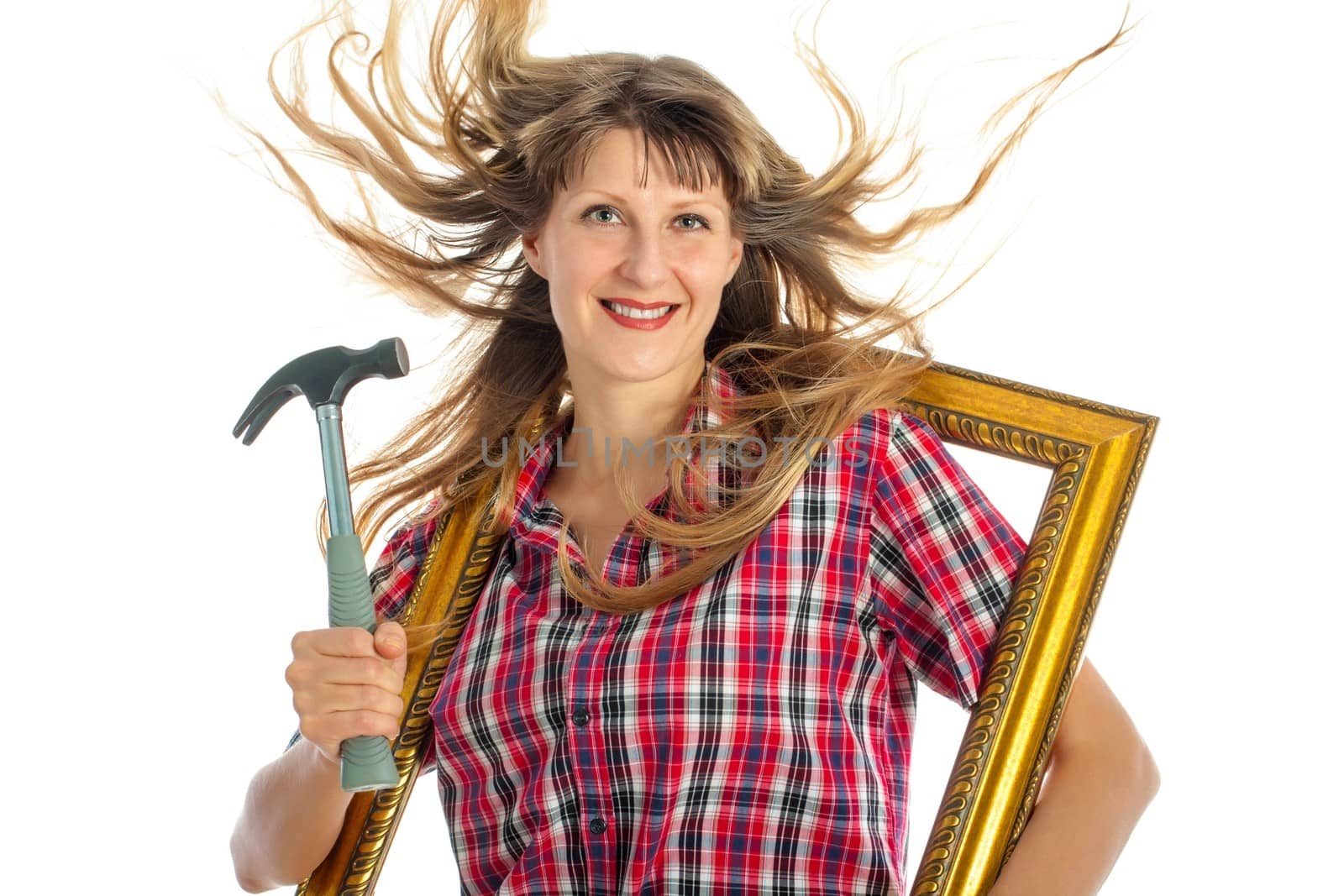 Young woman with frame and hammer on white background