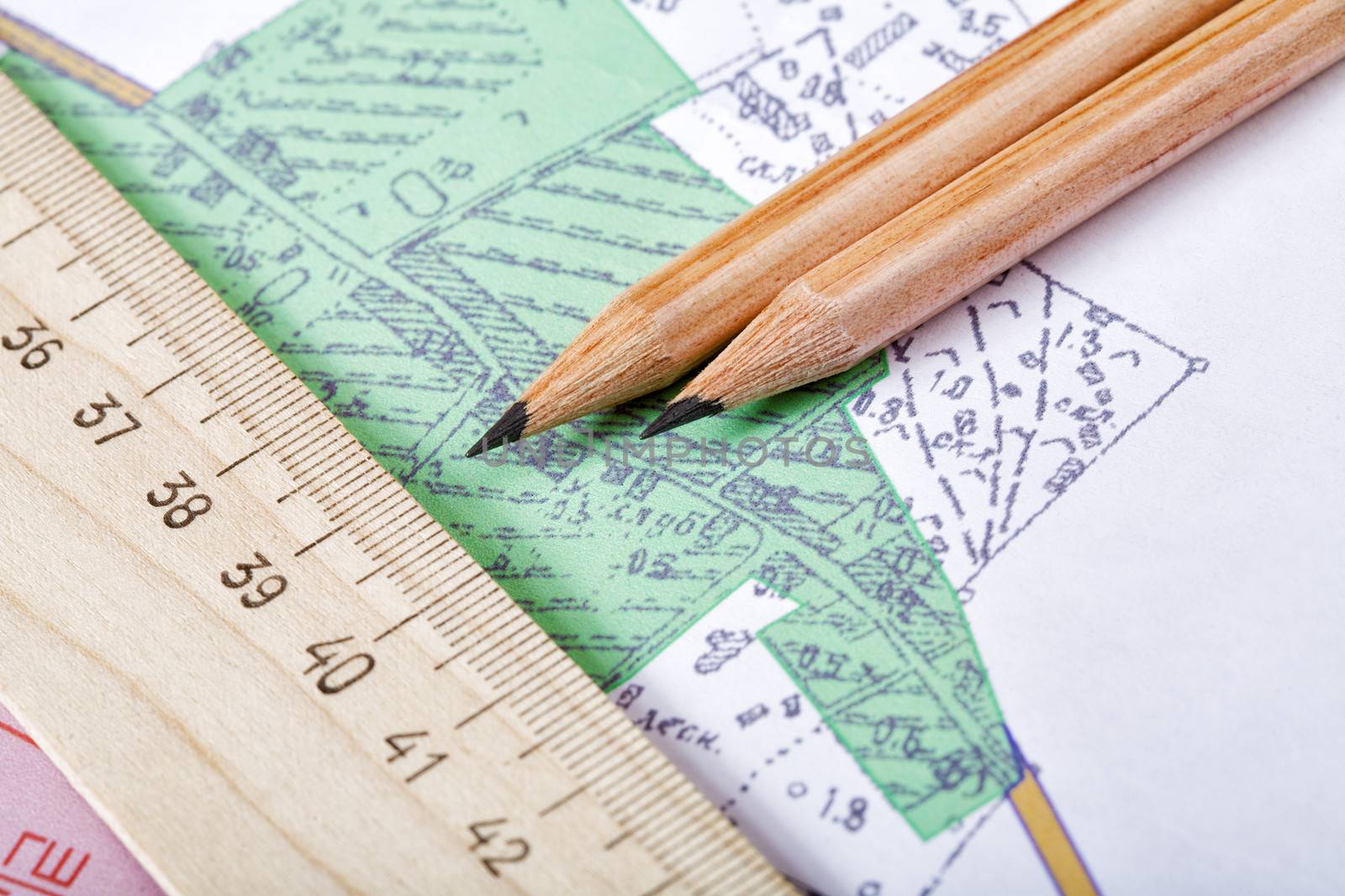 Topographic map and pencils close up