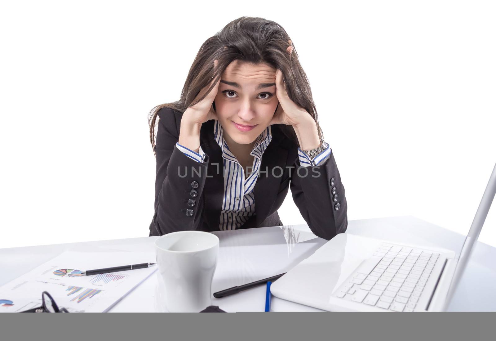 Portrait of stressed and frustrated young business woman with hands in her head over white background
