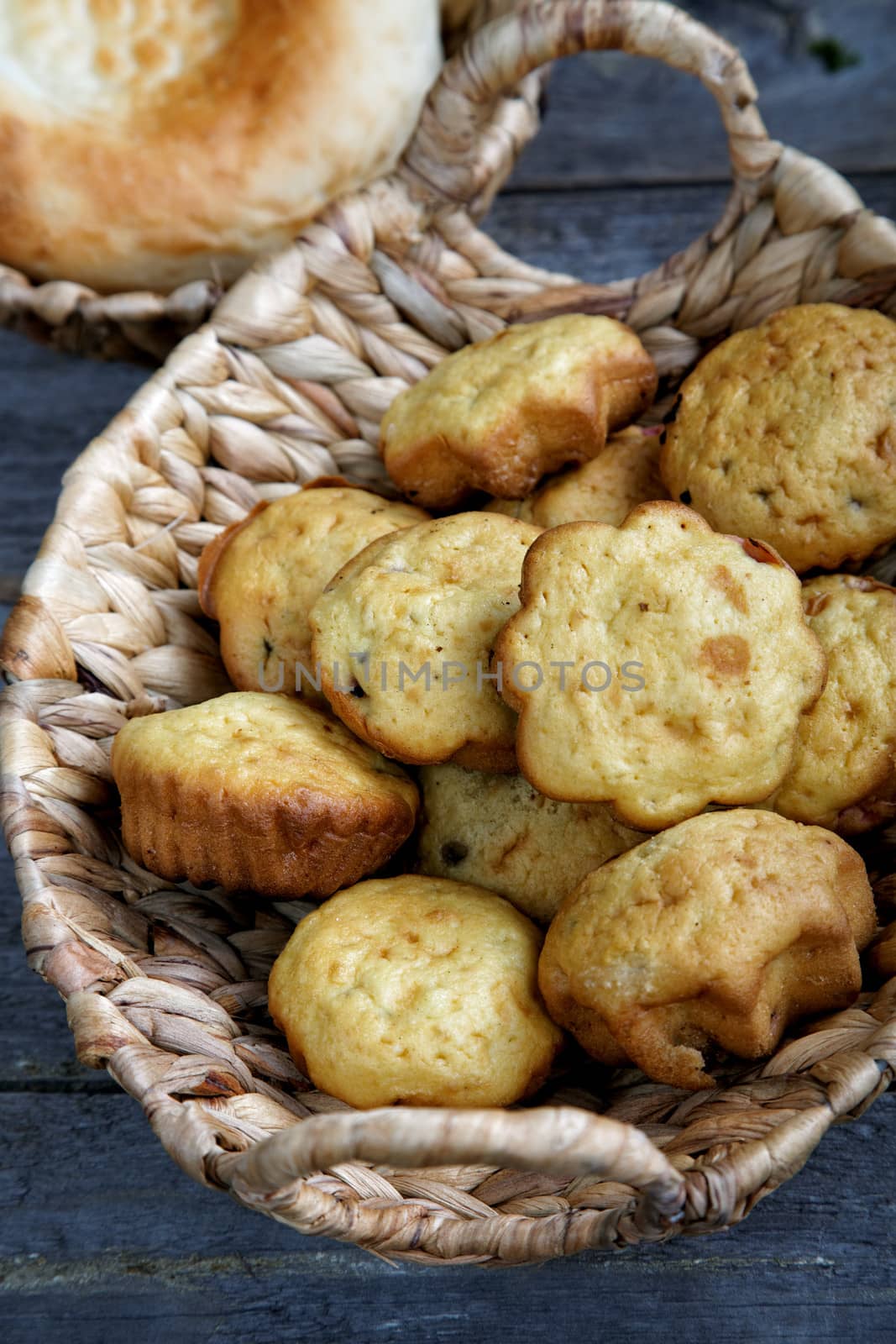 Rolls in a wattled basket on an old kitchen table