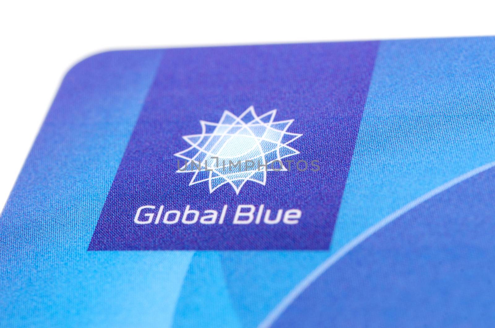 MUNICH, GERMANY - FEBRUAR 20, 2014: Close up corner of plastic card "Global Blue" with logo this tax free company. Isolated on white.