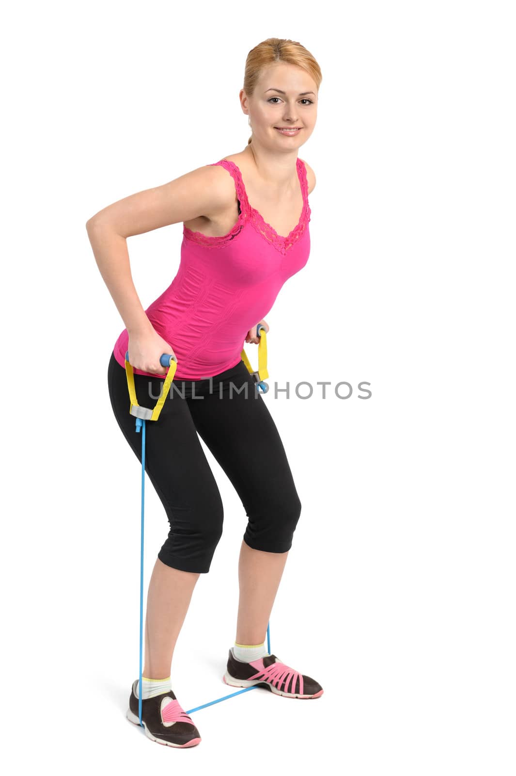 Female back and arms exercise using rubber resistance band