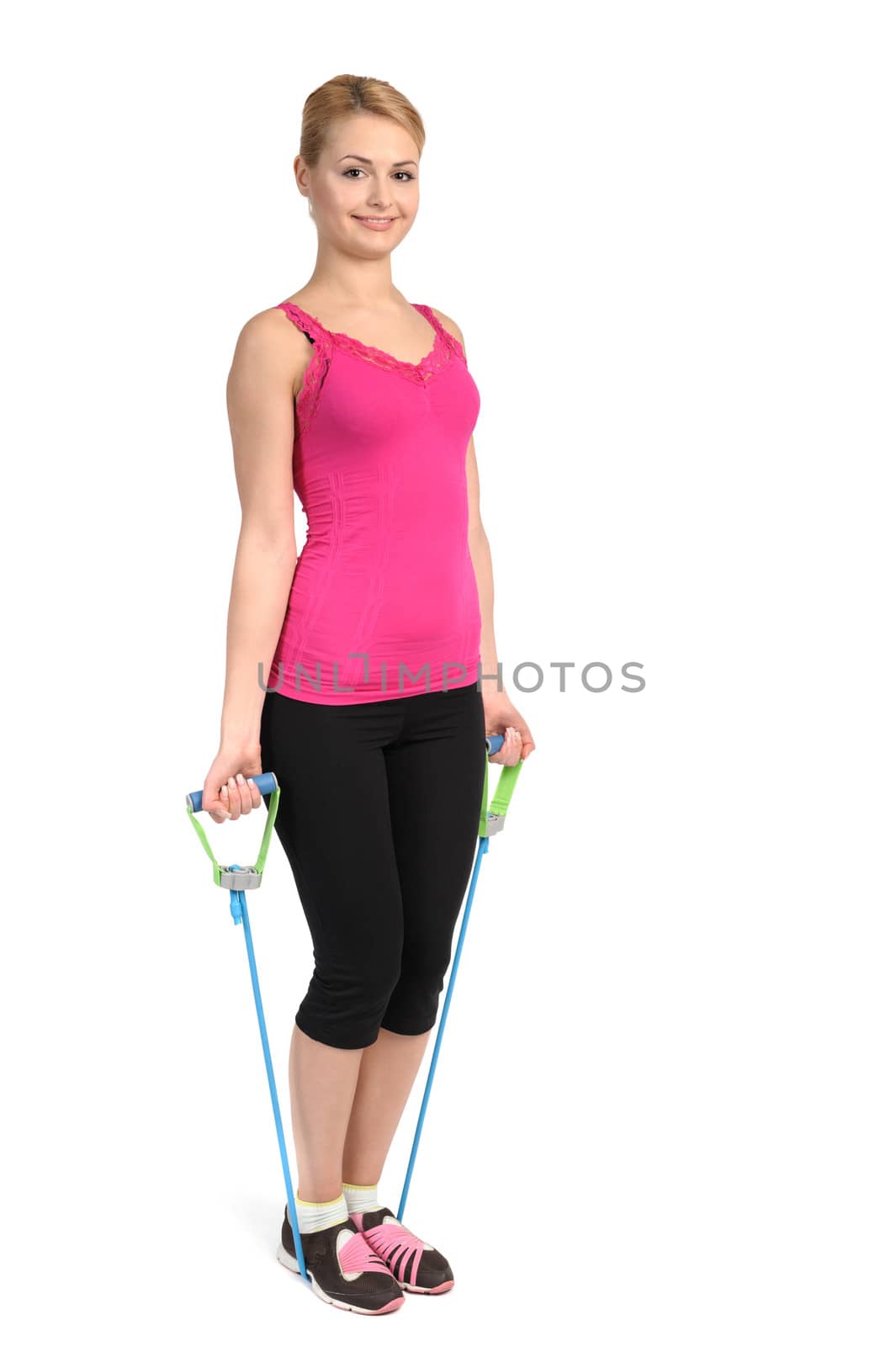 Young blond girl doing female biceps exercise using rubber resistance band. position 1 of 2.
