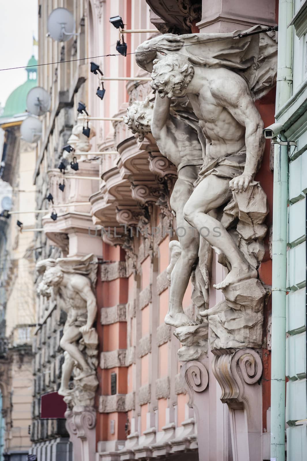 Statues near entrance, architectural details of Lvov Lviv, Ukraine.