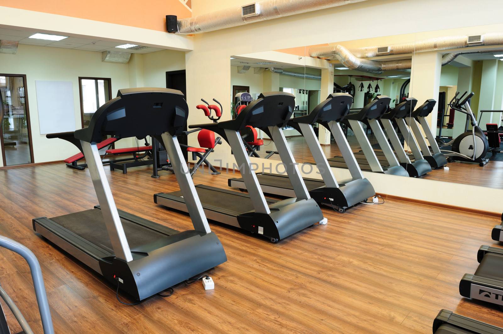 Set of treadmills staying in line in the gym