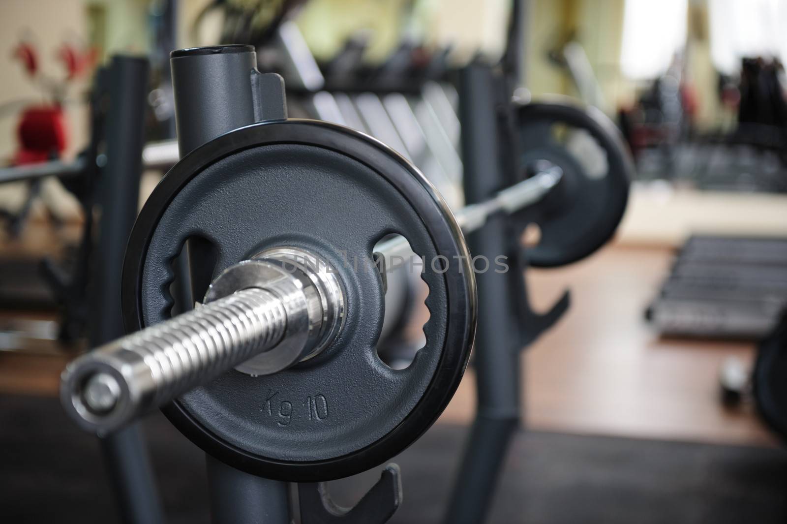 Barbell ready to workout, indooors, shallow DOF