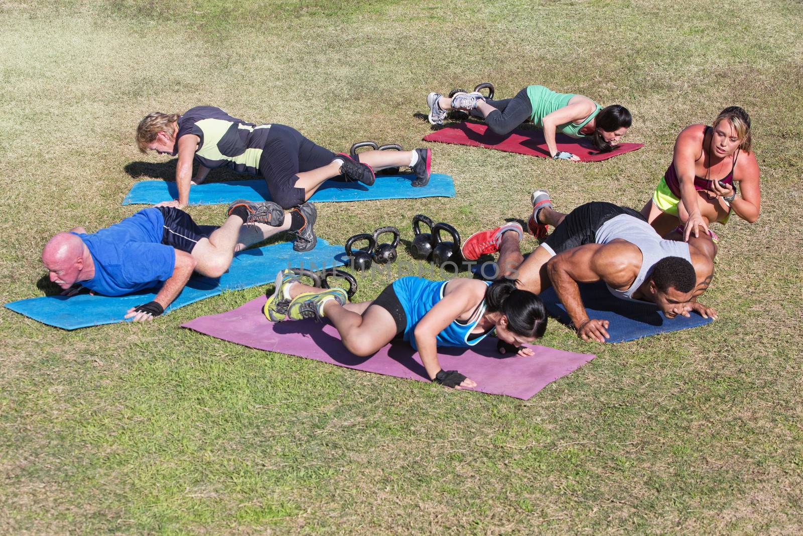 Adults Exercising Outdoors by Creatista