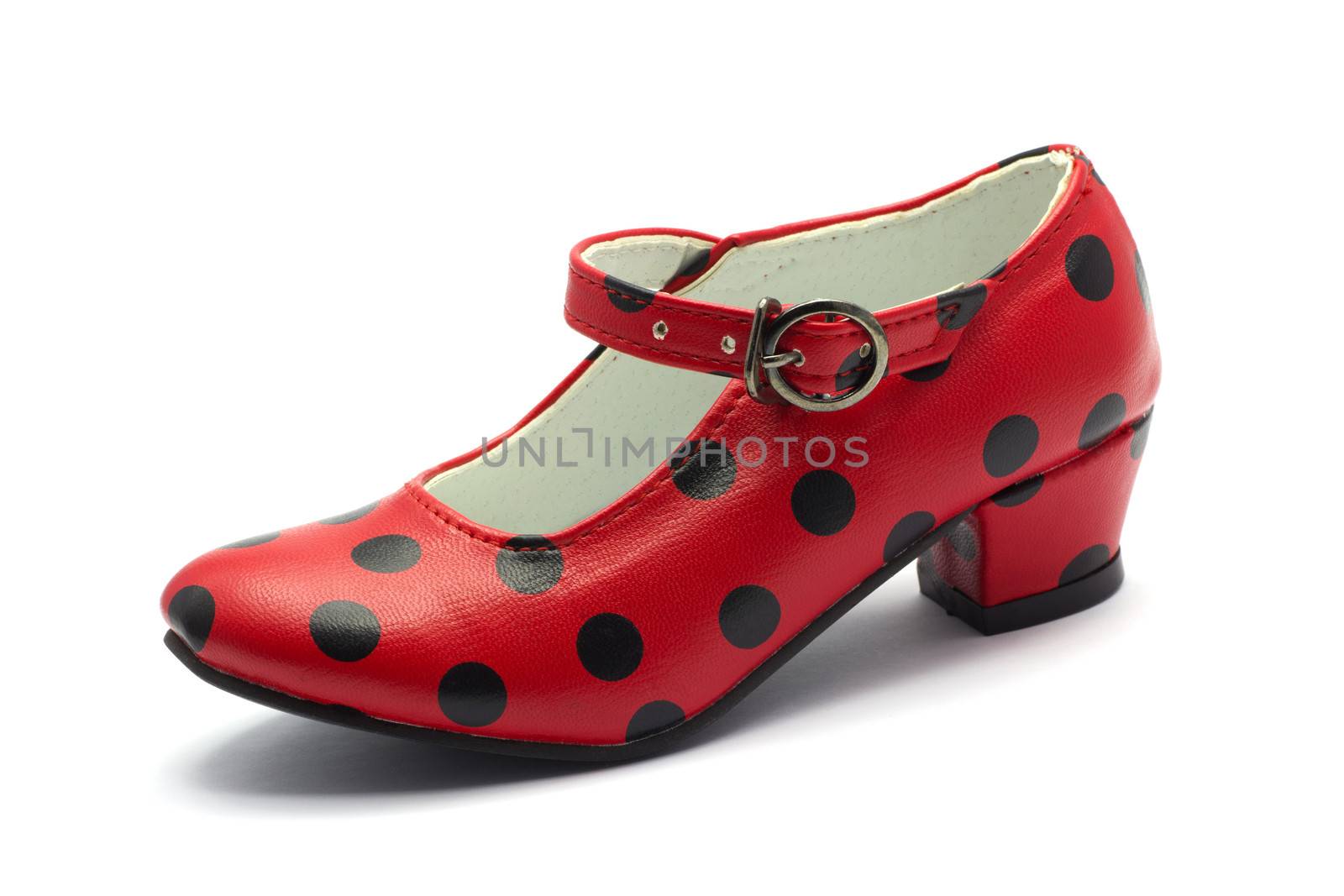 one Sevillian flamenco dancing shoe
Red shoe with black dots