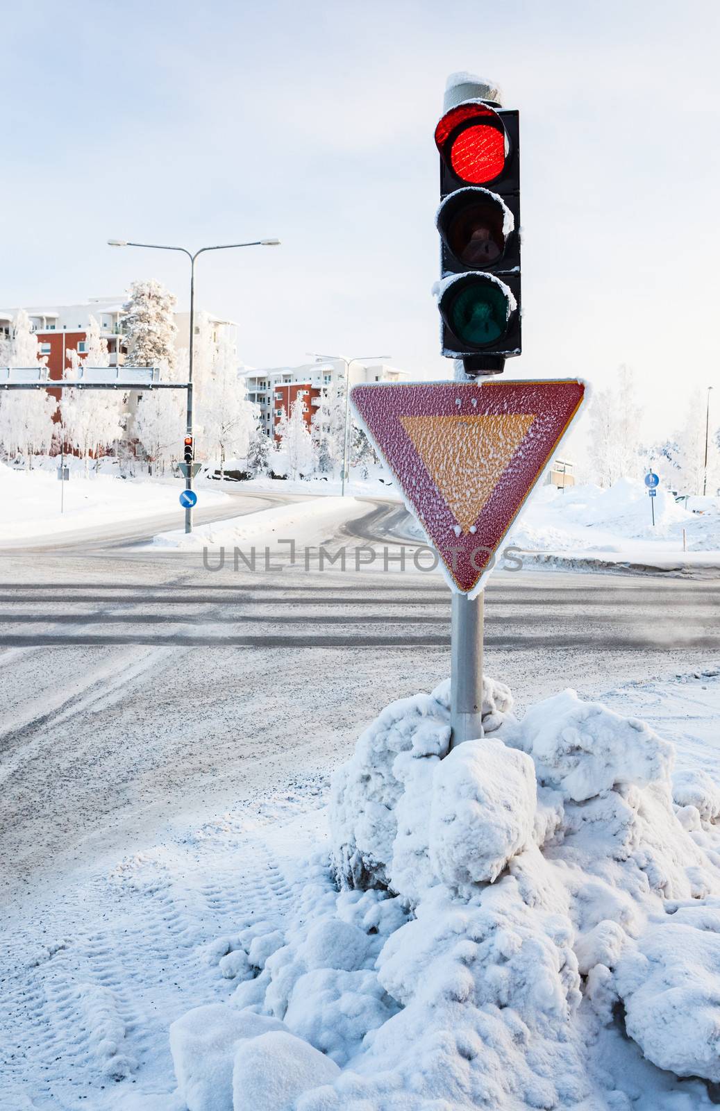 Red traffic light at winter