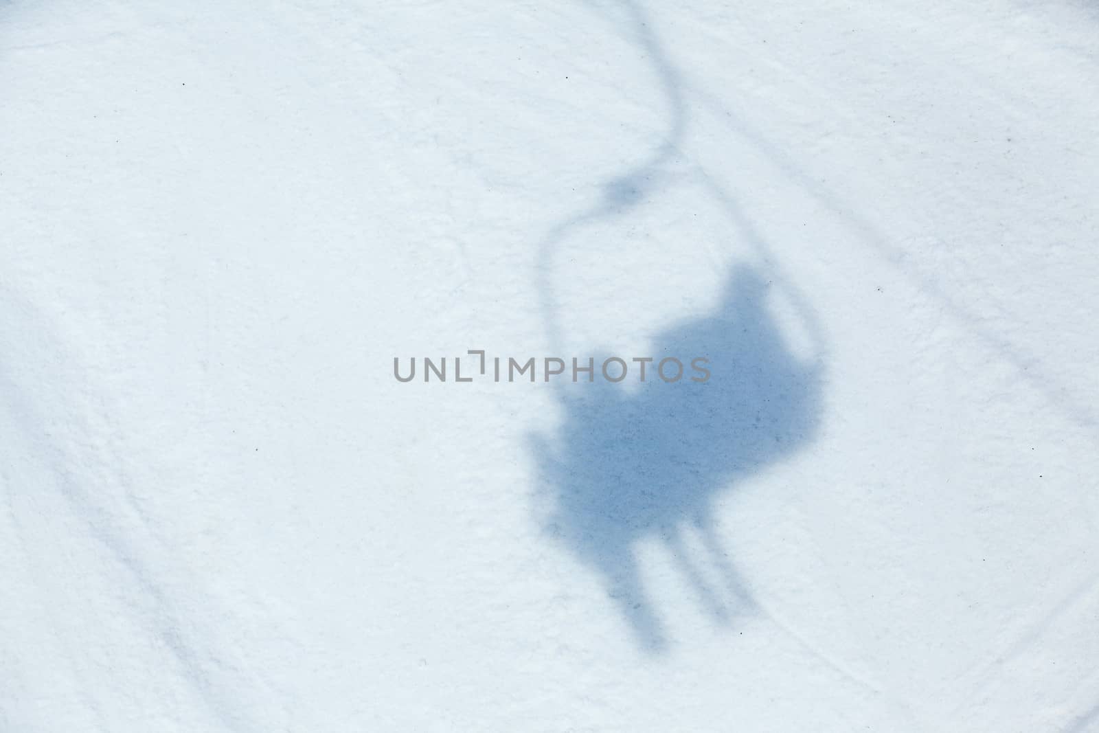 Ski lift shadow on the snow. Alps, Austria