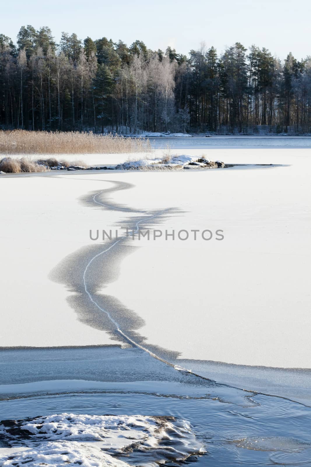 Thin ice on a lake by juhku