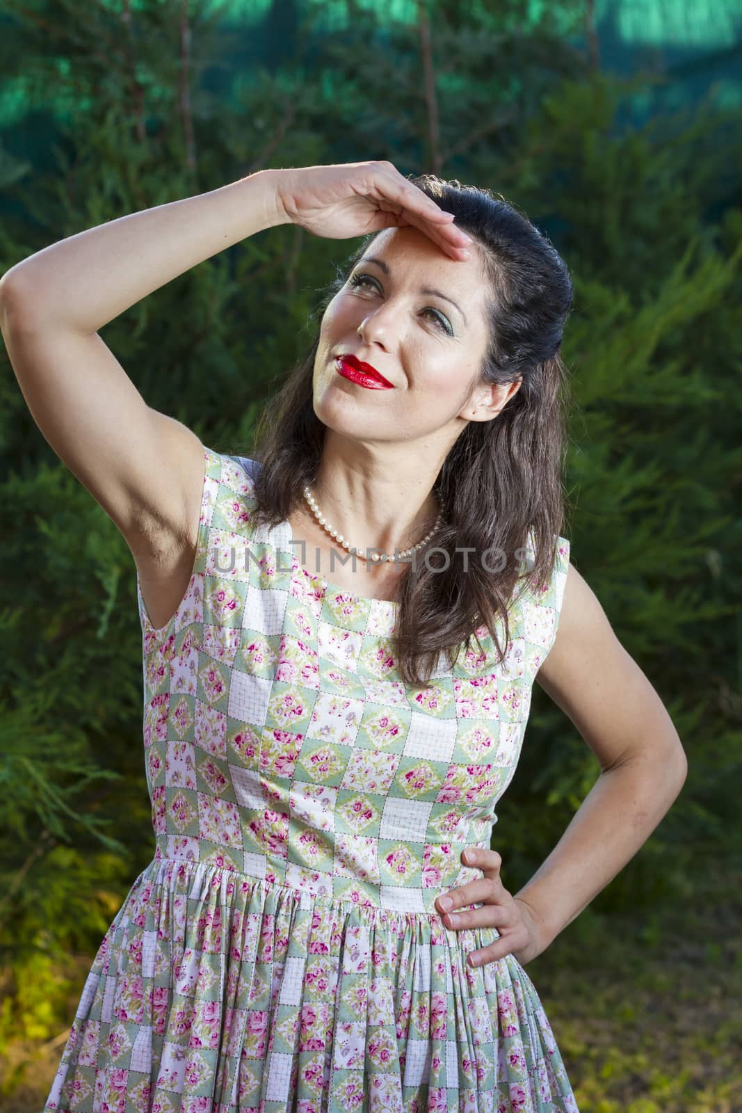 Woman gardening. Mature girl gardening in her backyard. spring season, rural scene