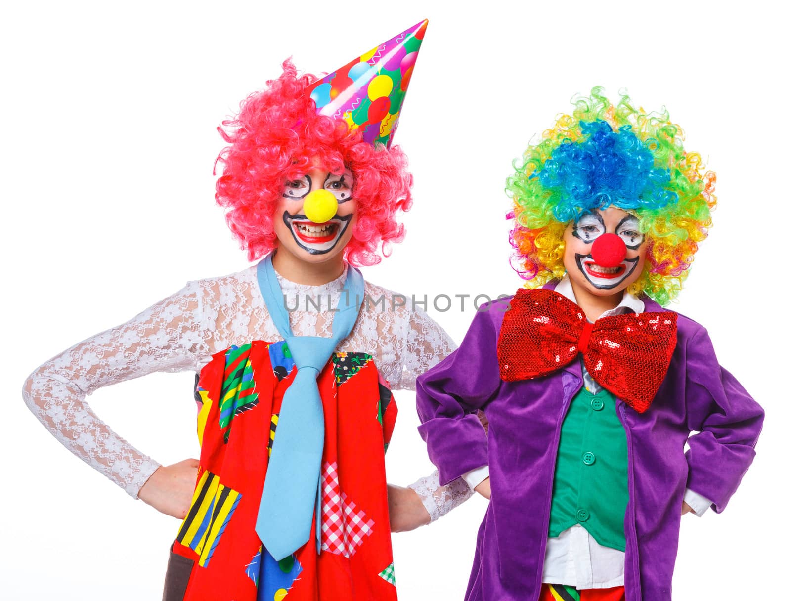 Portrait of a cute boy and girl clowns. Isolated on white background.