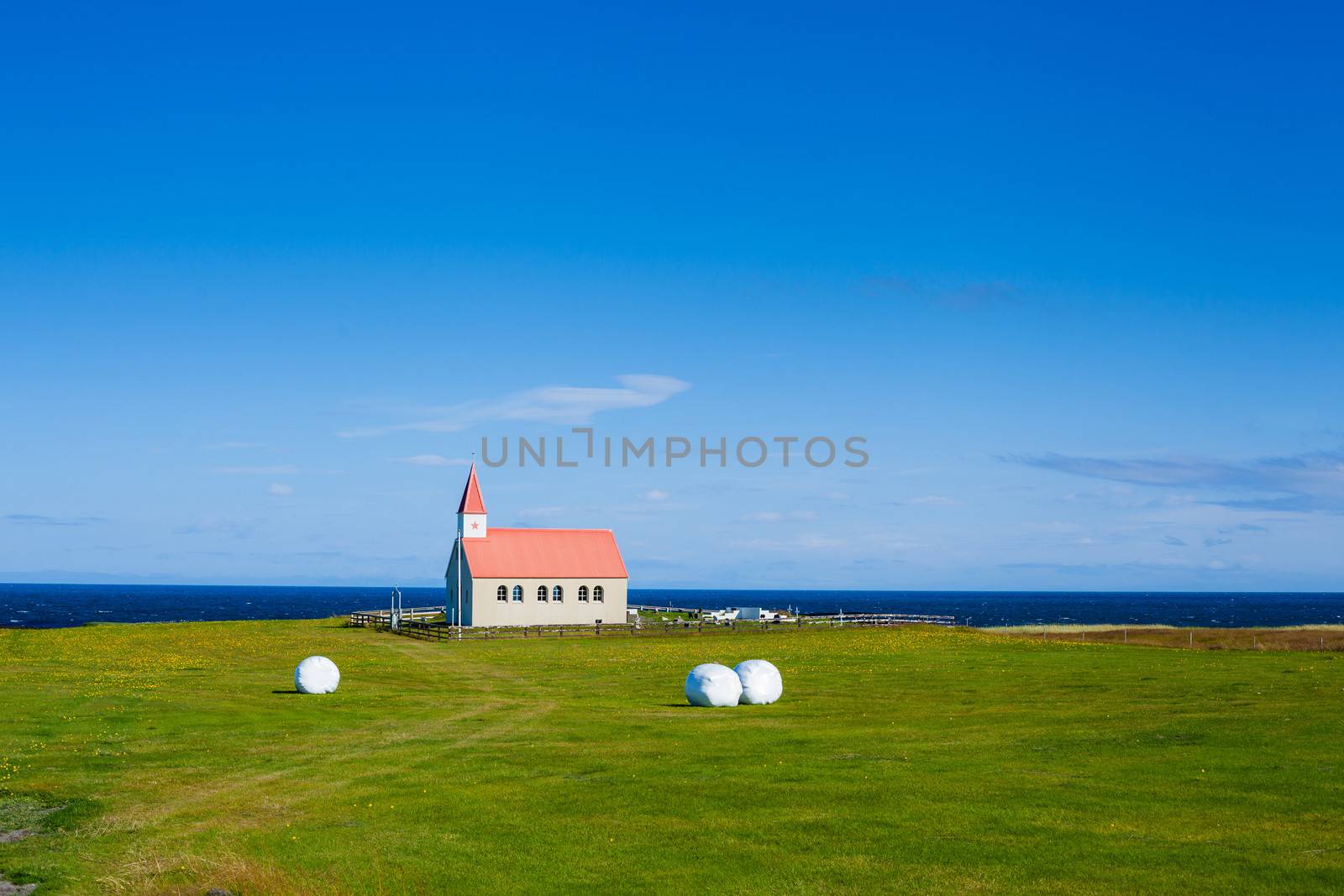 Typical Rural Icelandic Church under a blue summer sky. Horizontal shot