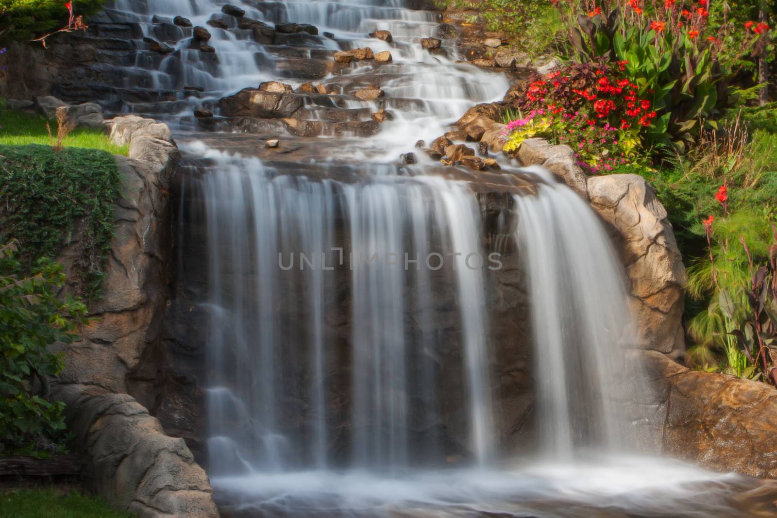 A small Waterfall at the rivers bank in soft focus