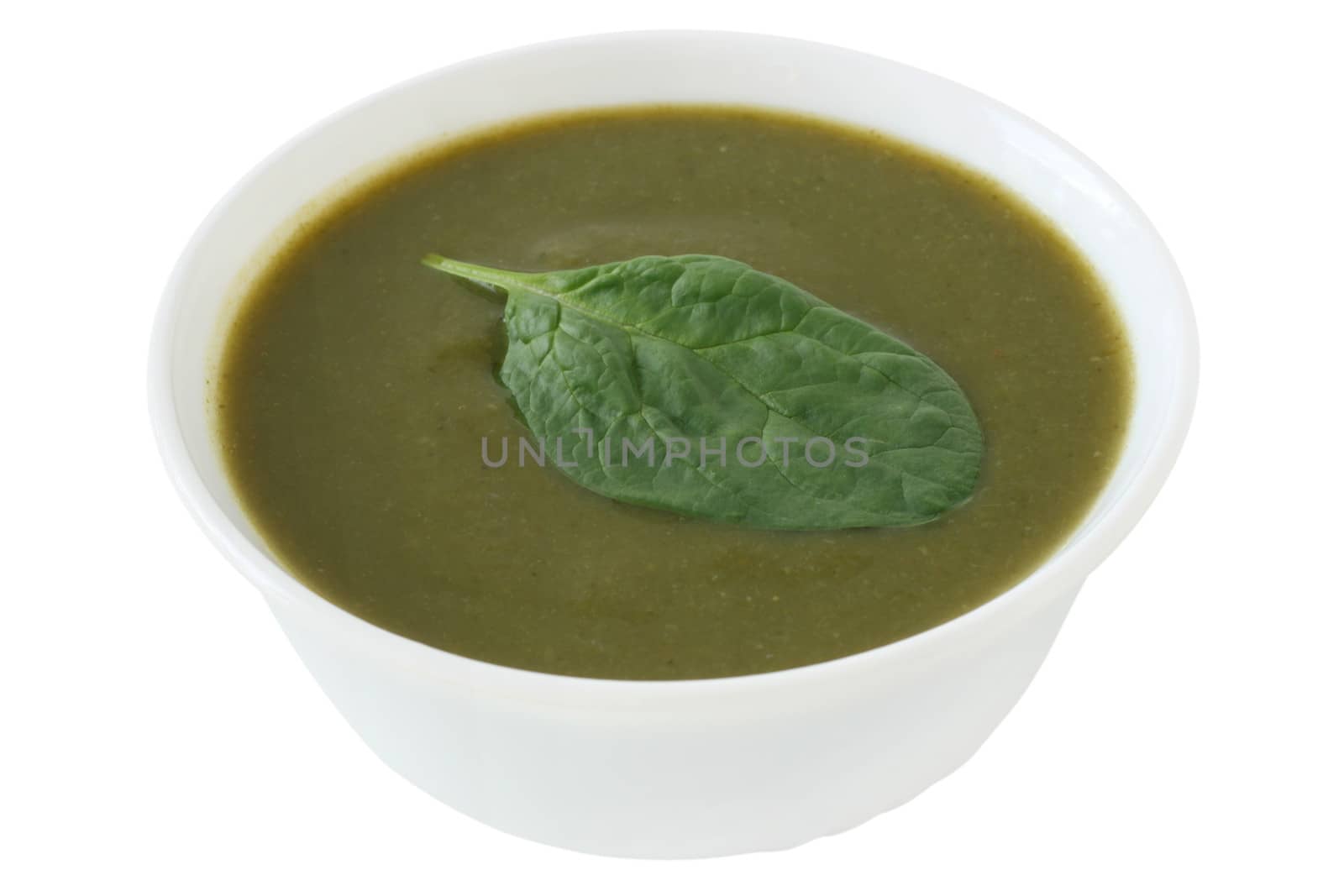 spinach soup in the white bowl