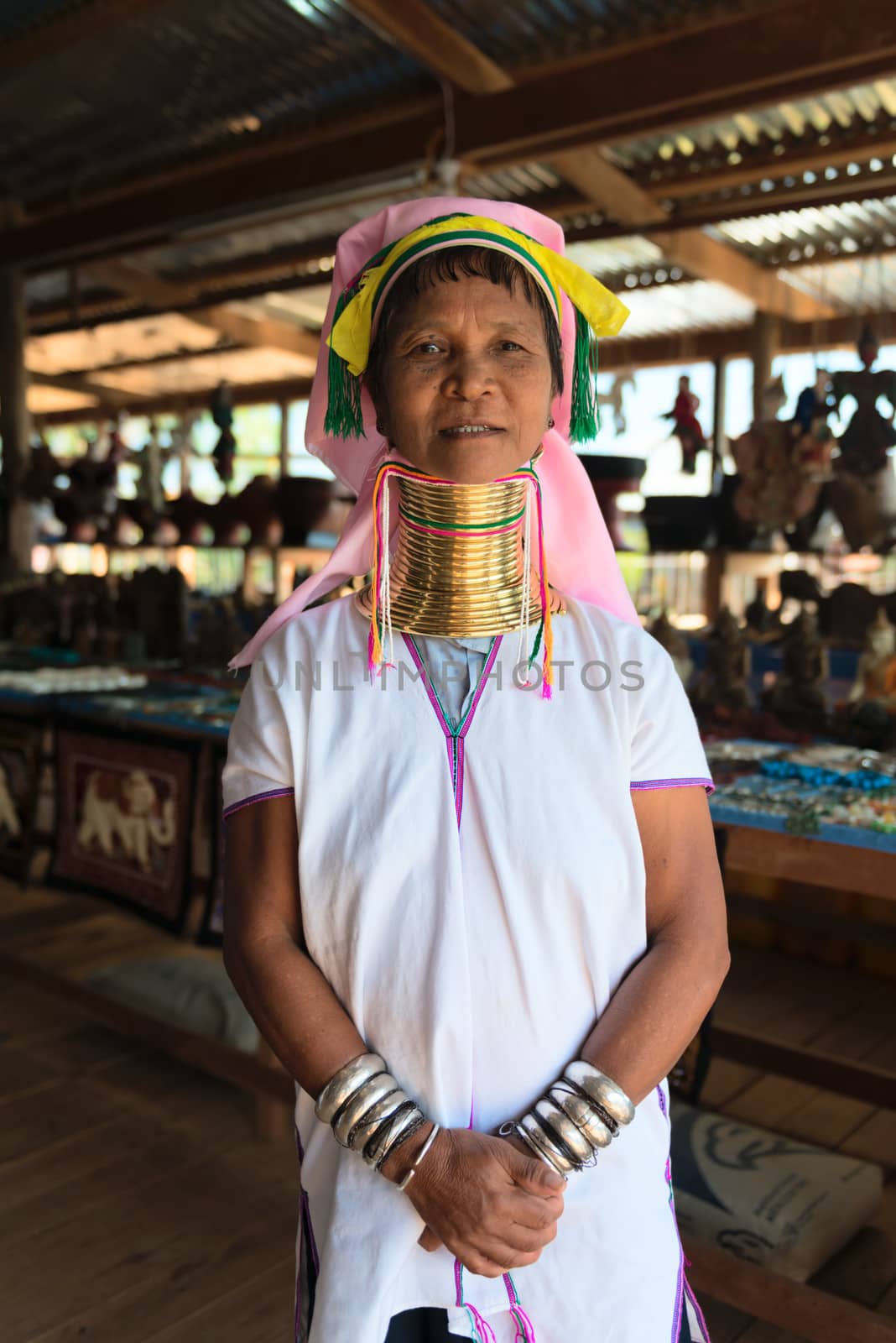 INLE LAKE, MYANMAR (BURMA) - 07 JAN 2014: Unidentified Padaung (Kayan Lahwi) tribe woman poses for a portrait. This tribe is called "long neck" because of metal rings around their necks.