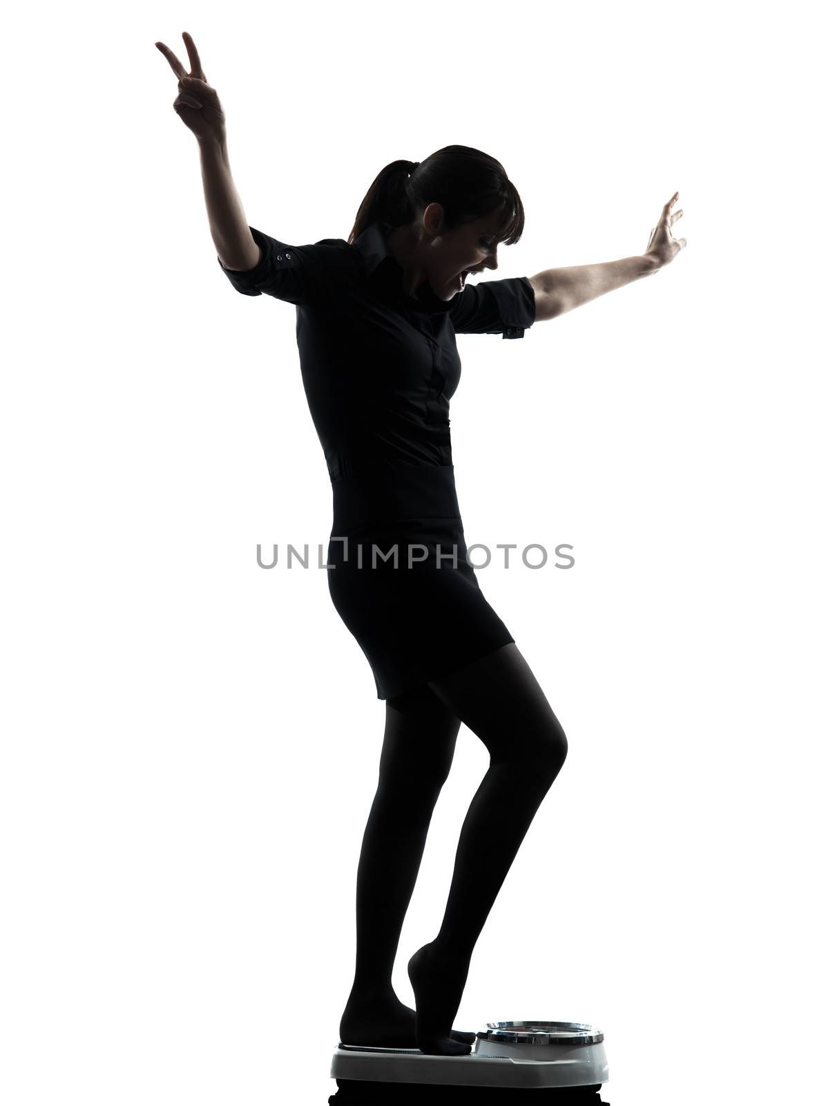 one woman standing on weight scale happy silhouette studio isolated on white background