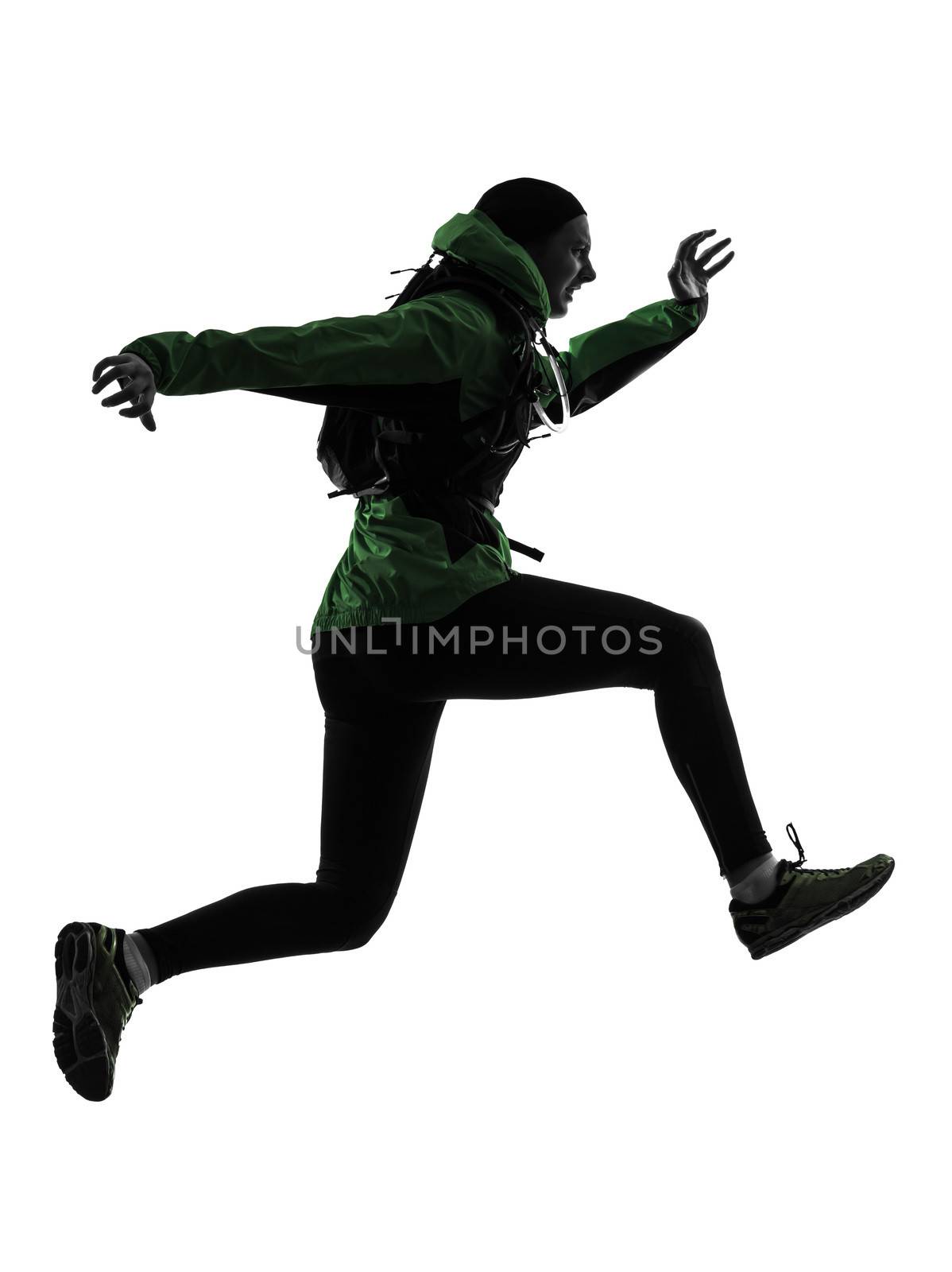 one caucasian woman runner running trekking in silhouette studio isolated on white background