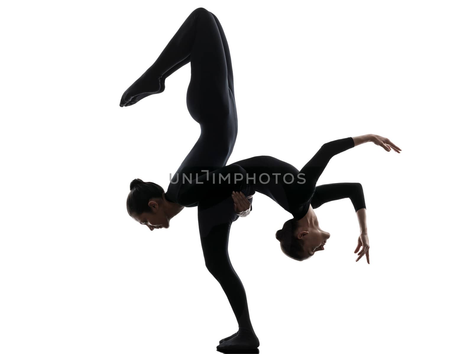 two women contortionist practicing gymnastic yoga in silhouette  on white background