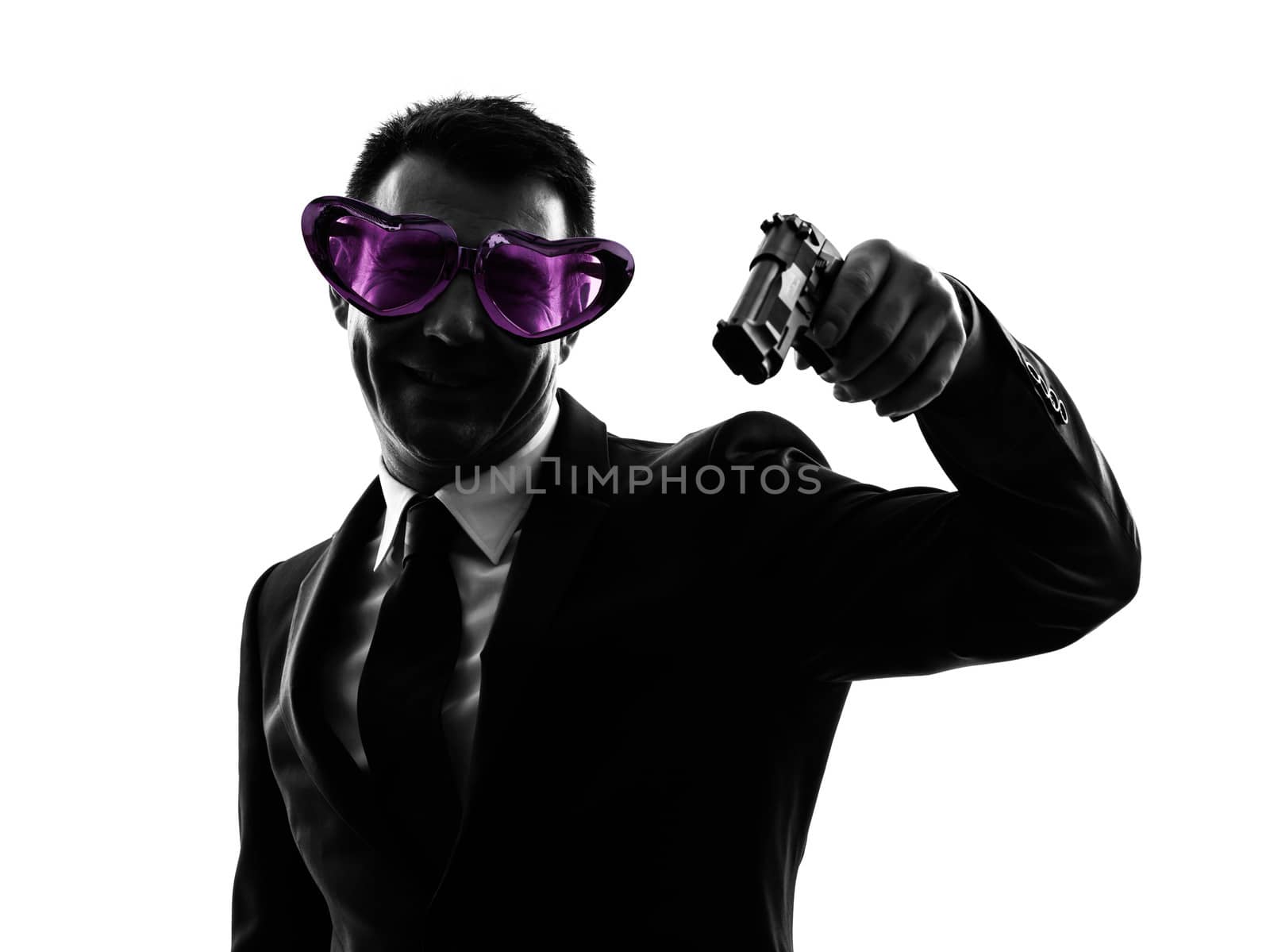 one caucasian business man with heart shaped glasses aiming in silhouette  on white background