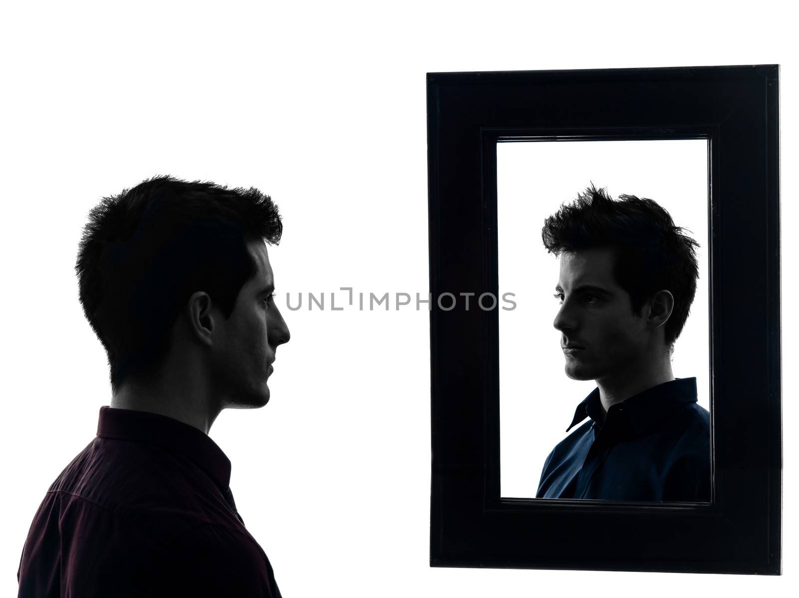 man in front of his mirror in shadow white background