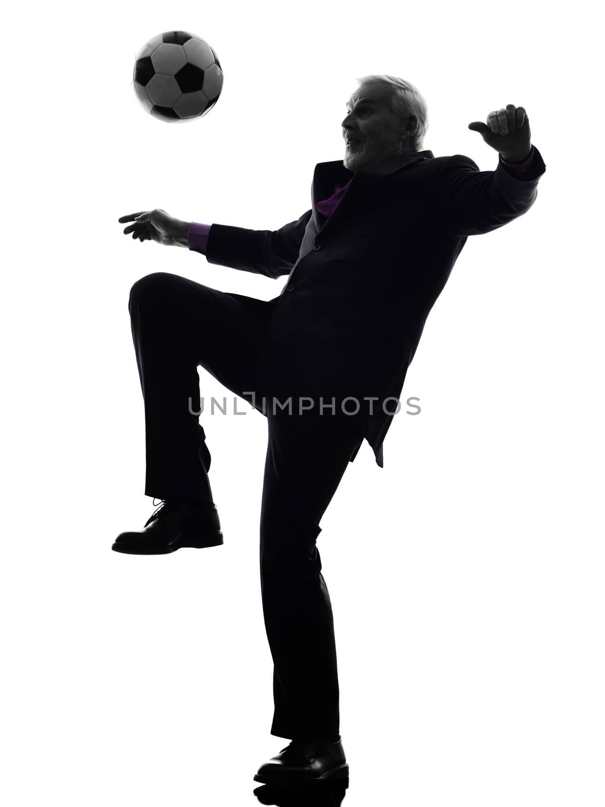 One Caucasian Senior Business Man playing soccer Silhouette White Background