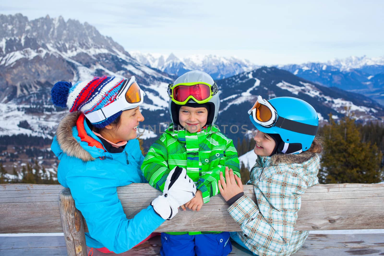 Ski, winter, snow, skiers, sun and fun - family enjoying winter vacations.