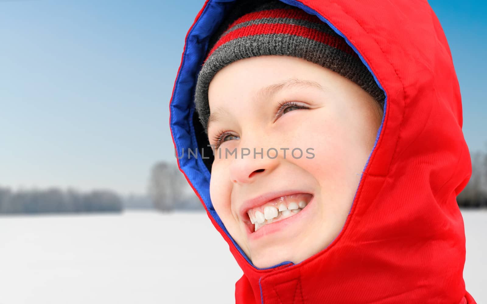 Happy Kid in the the sunny Winter day