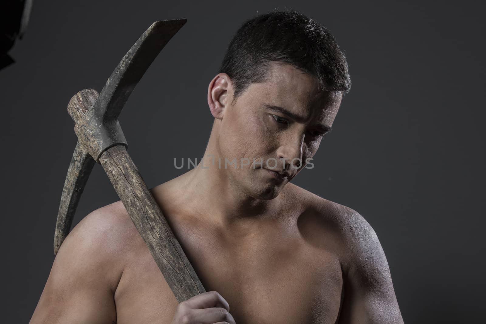 Engineer, Construction worker portrait holding a peak. by FernandoCortes