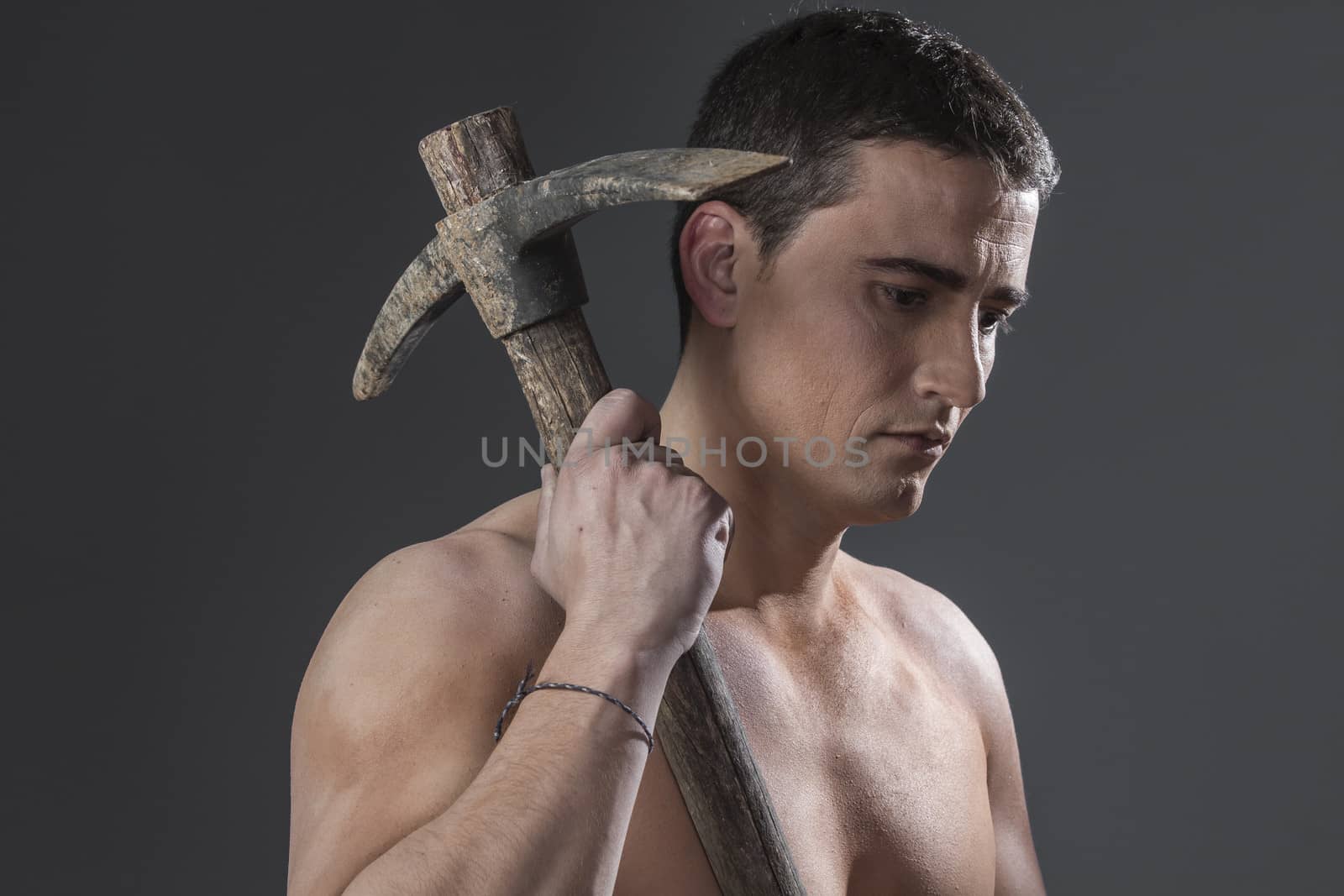 Tool, Construction worker portrait holding a peak. by FernandoCortes