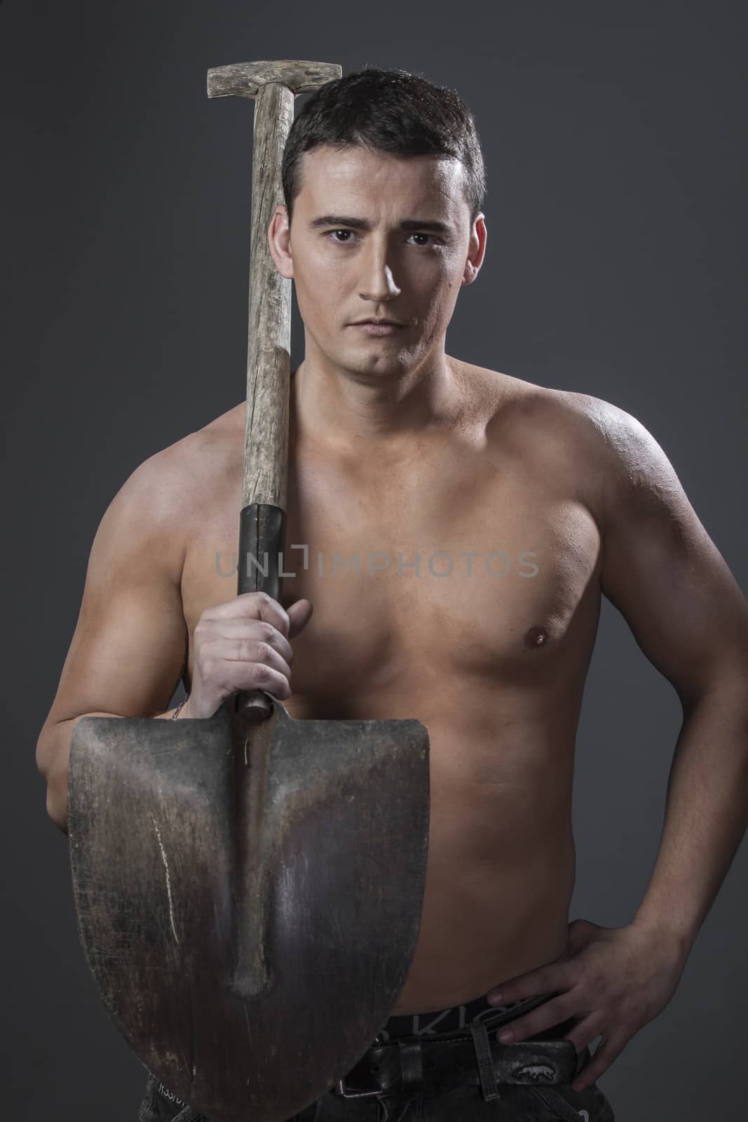 Labour, Male worker holding a shovel, sexy builder by FernandoCortes