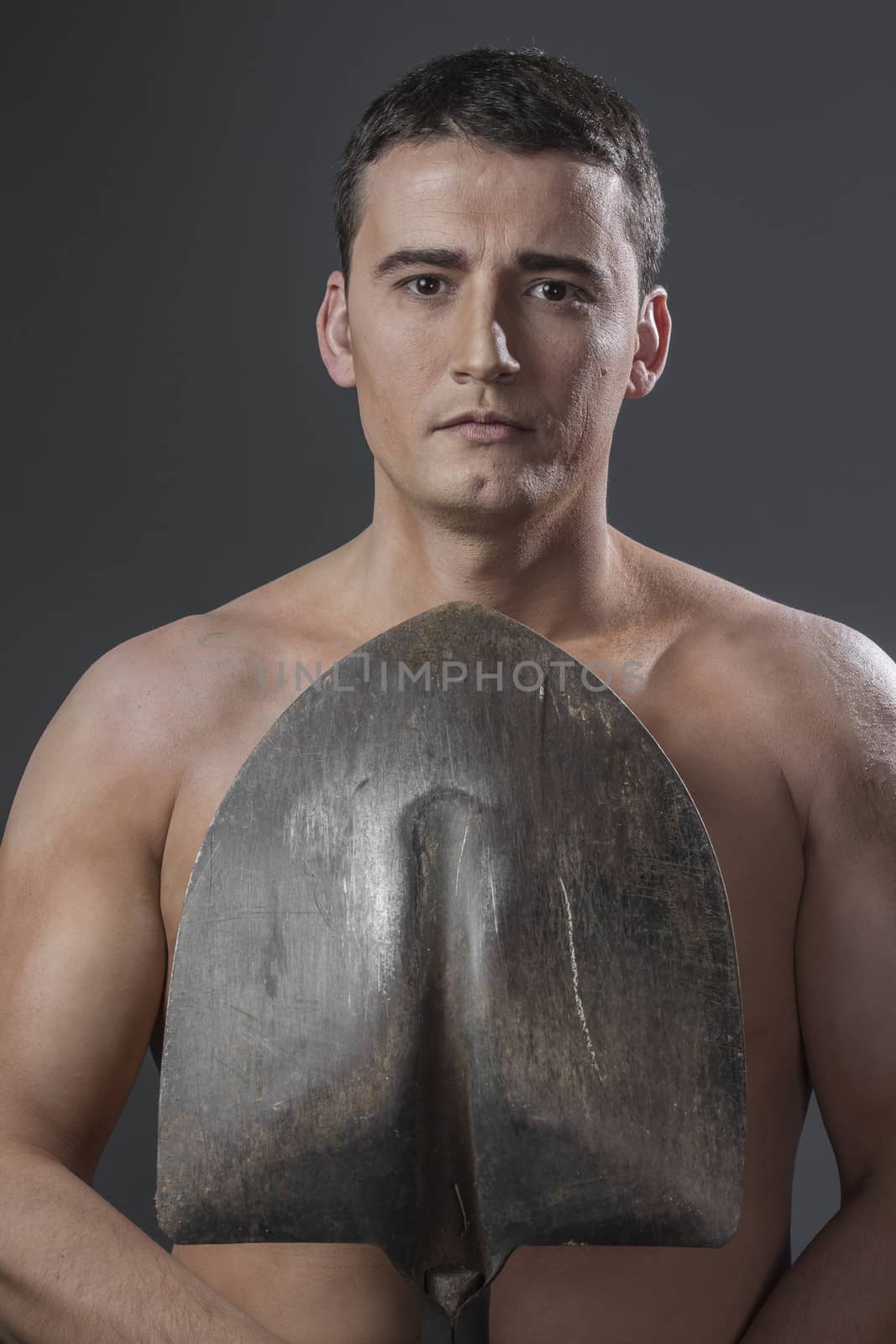 Builder.Male worker holding a shovel, sexy builder by FernandoCortes