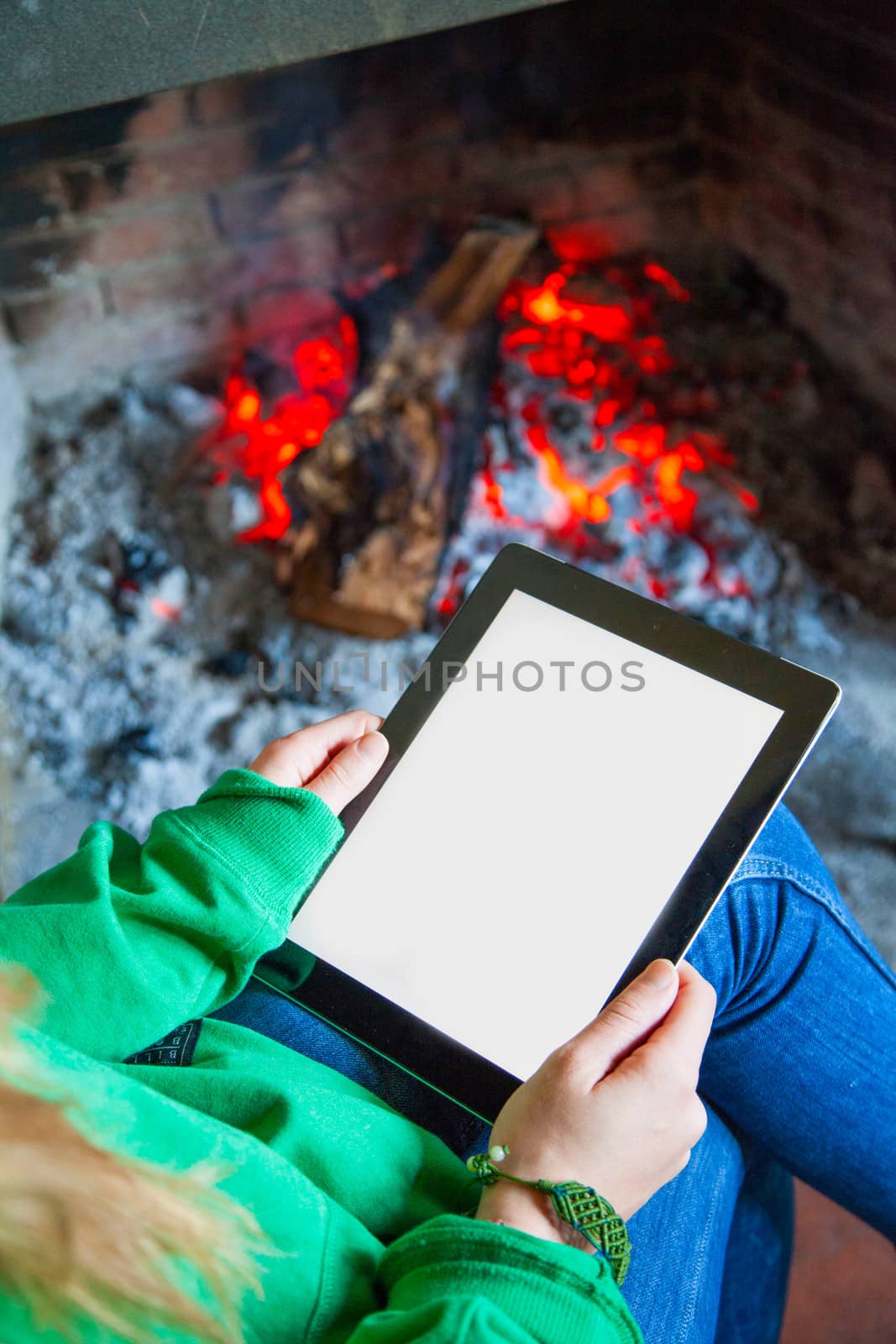 Reading book on digital tablet by Caracarafoto