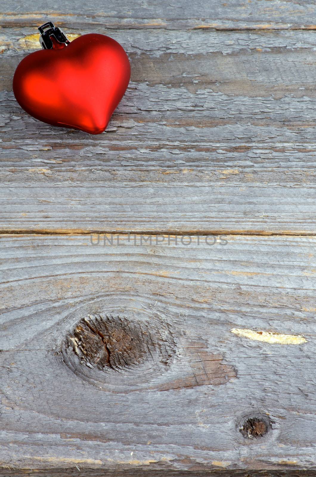 Red Plastic Hearts isolated on Rustic Wood background