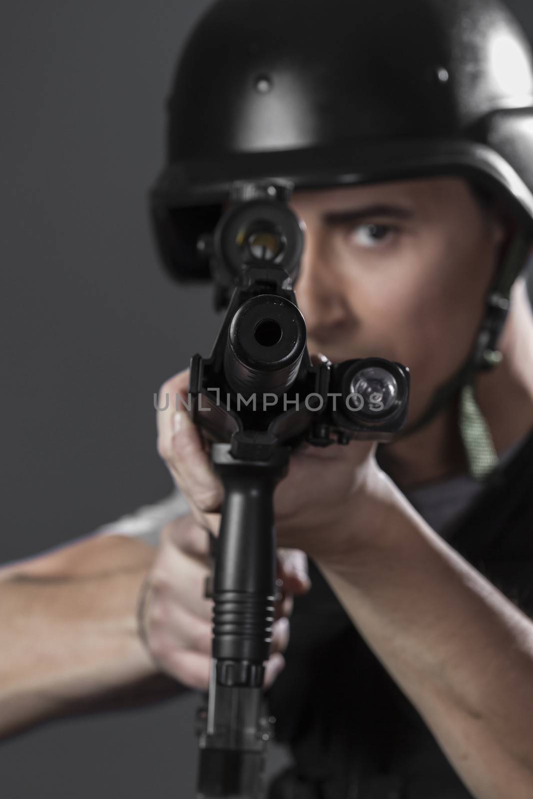 paintball sport player wearing protective helmet aiming pistol , by FernandoCortes