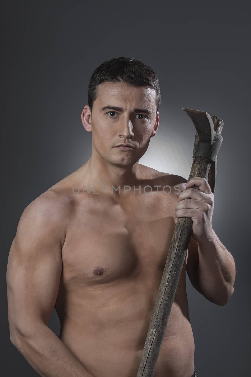 Construction worker portrait holding a peak. by FernandoCortes